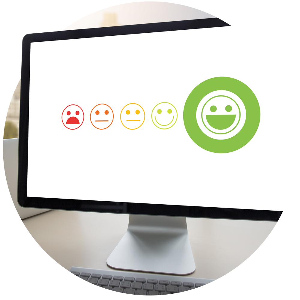 Circular image of a computer with a happiness scale