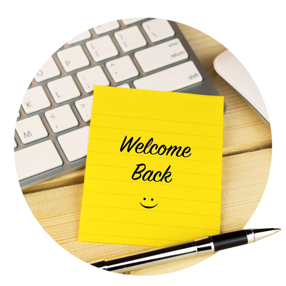 Circular image of a yellow note with "welcome back"