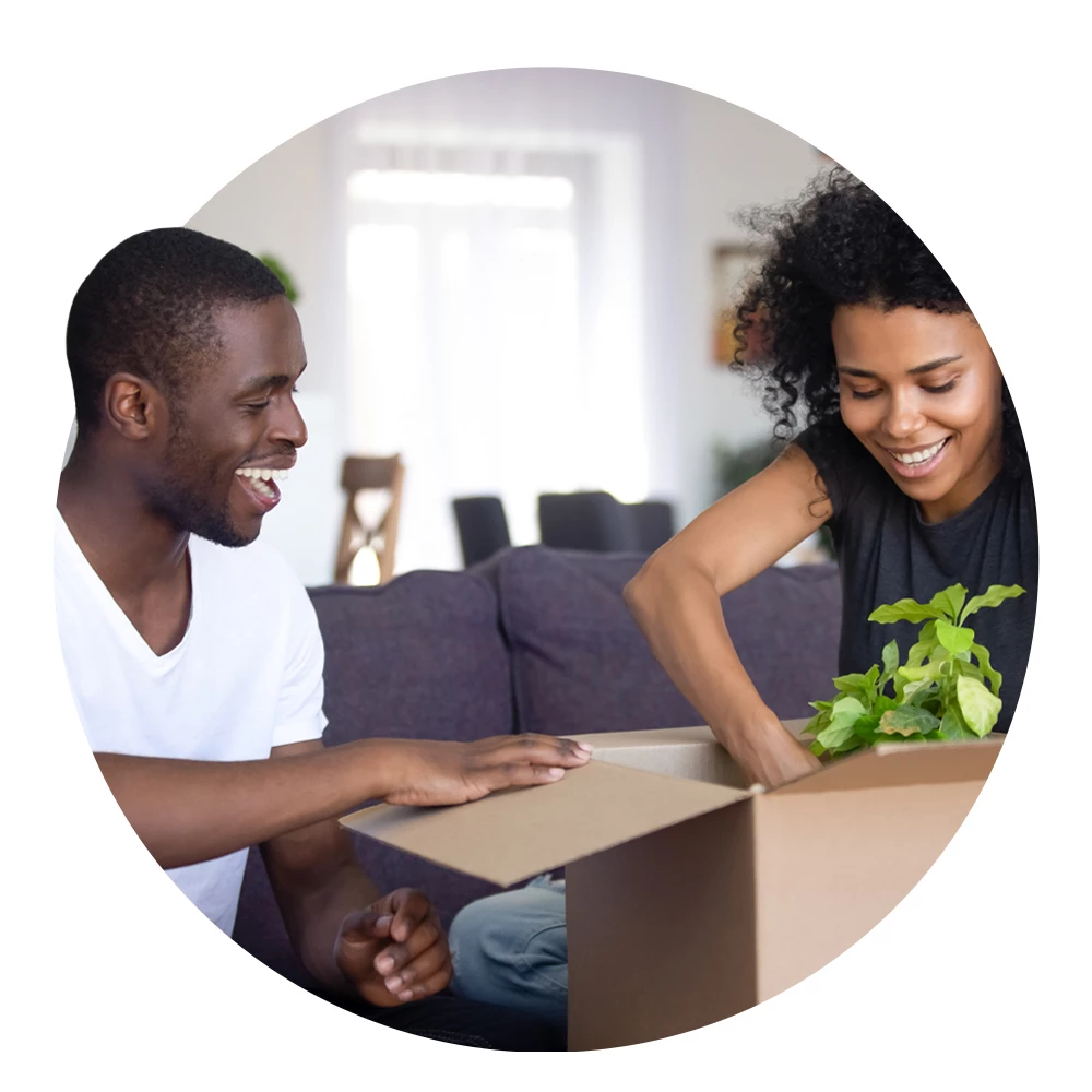 Circular image of a couple moving into a new home