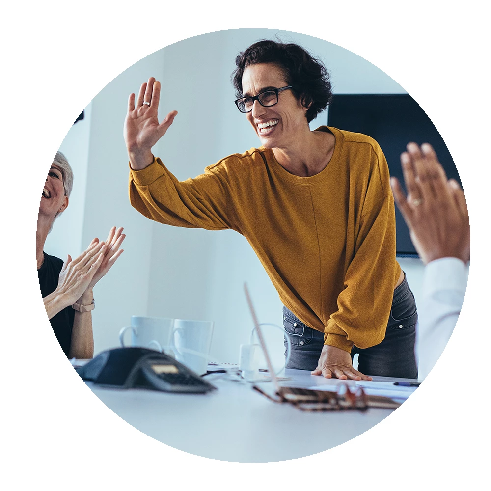 Decorative image of manager motivating team members in meeting