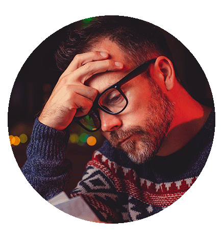 Circular image of a manager wearing a Christmas jumper stressed about seasonal hiring