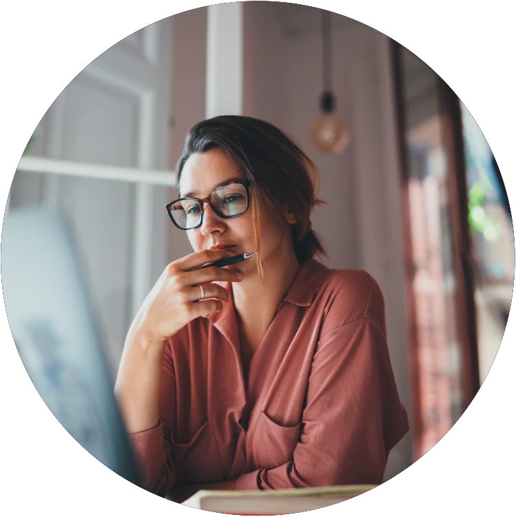 Empower growth and safety with Learn LMS, where a focused woman is working.