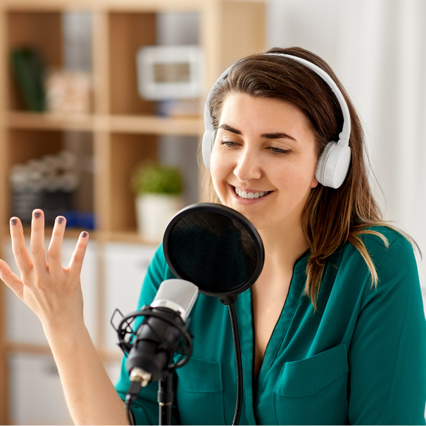 Person recording a podcast for audio learning purposes