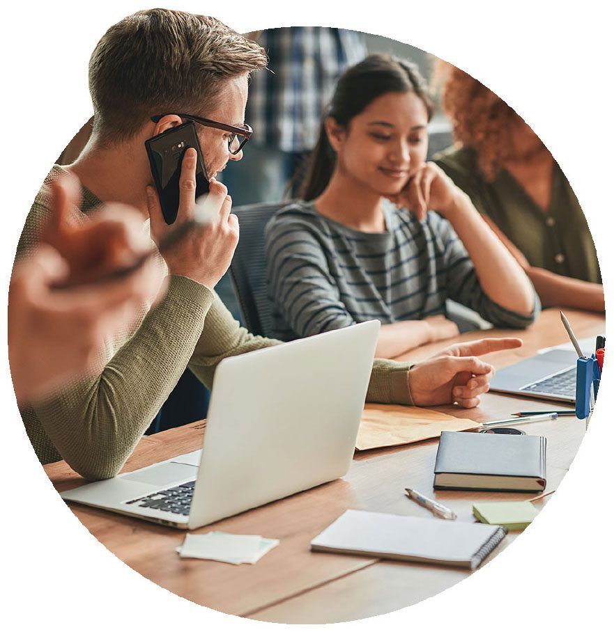 potential Kallidus team members speaking over the phone during in-person meeting